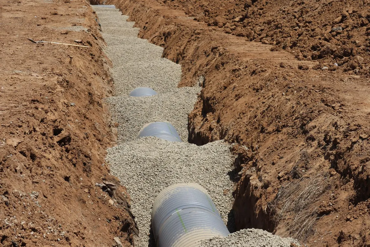 Sprinkler system installation in Bakersfield, CA: pipe laid in a trench